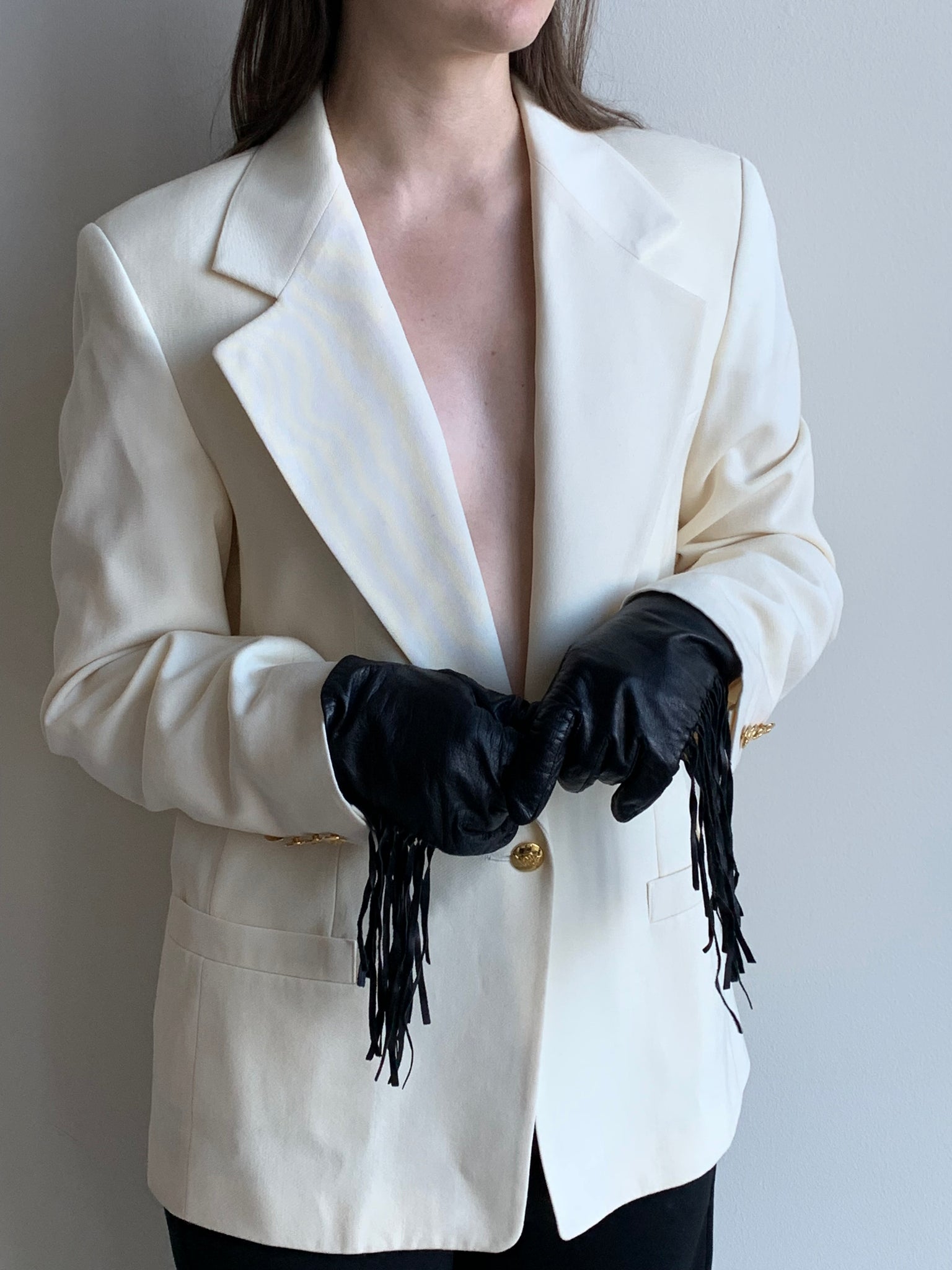 black leather gloves with fringe