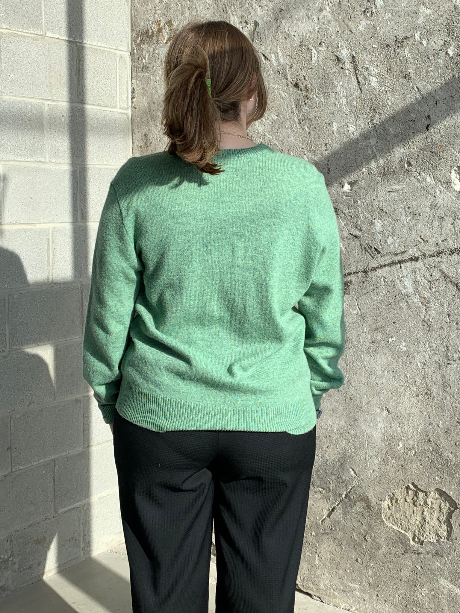 green wool sweater