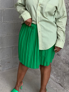 green pleated mini skirt