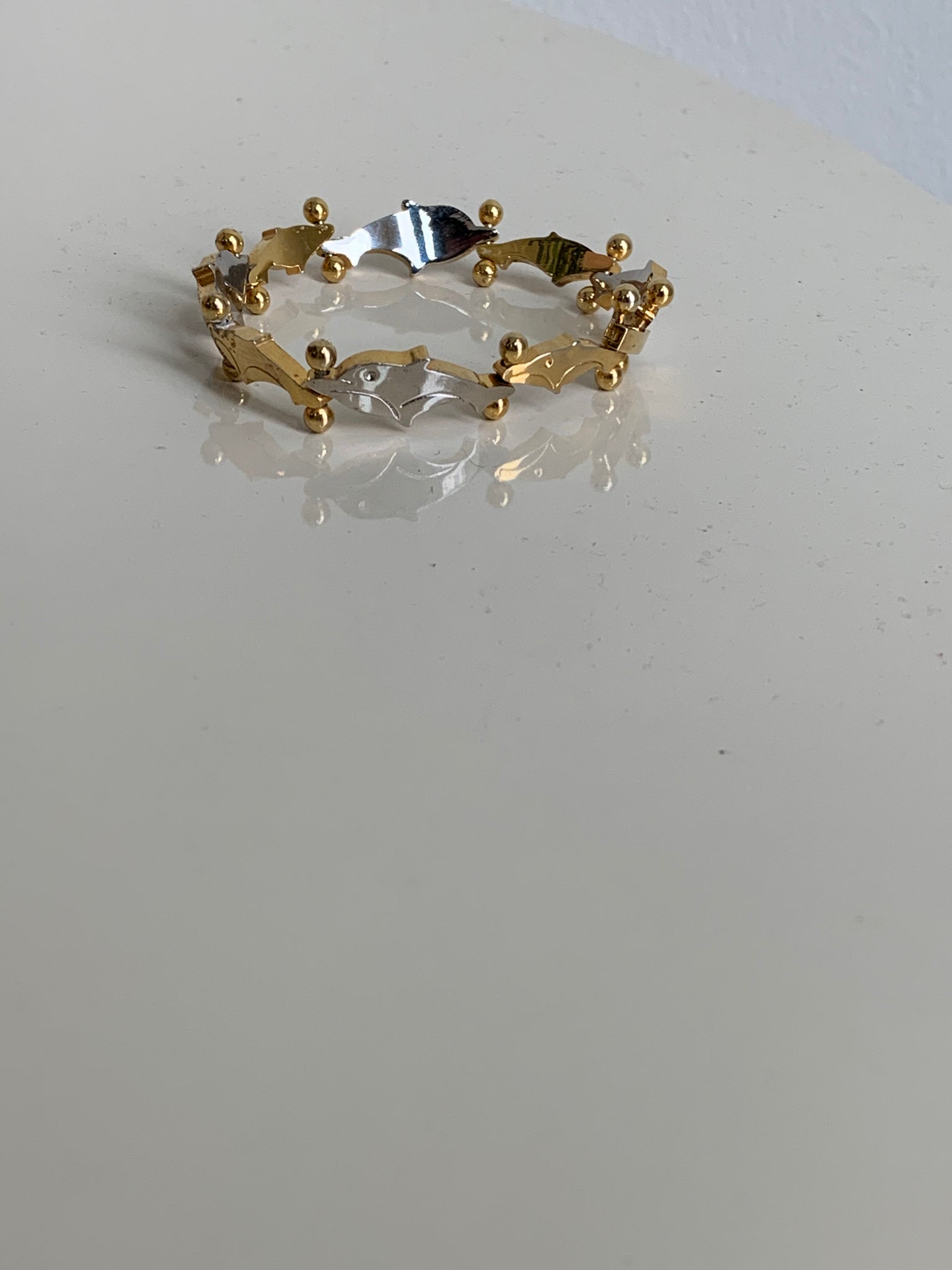 gold and silver dolphin bracelet